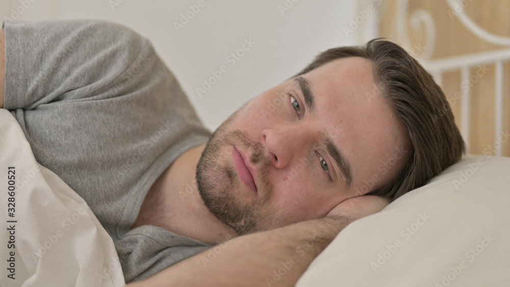 Portrait of Young Man Thinking in Bed Portrait of Young Man Thinking in Bed