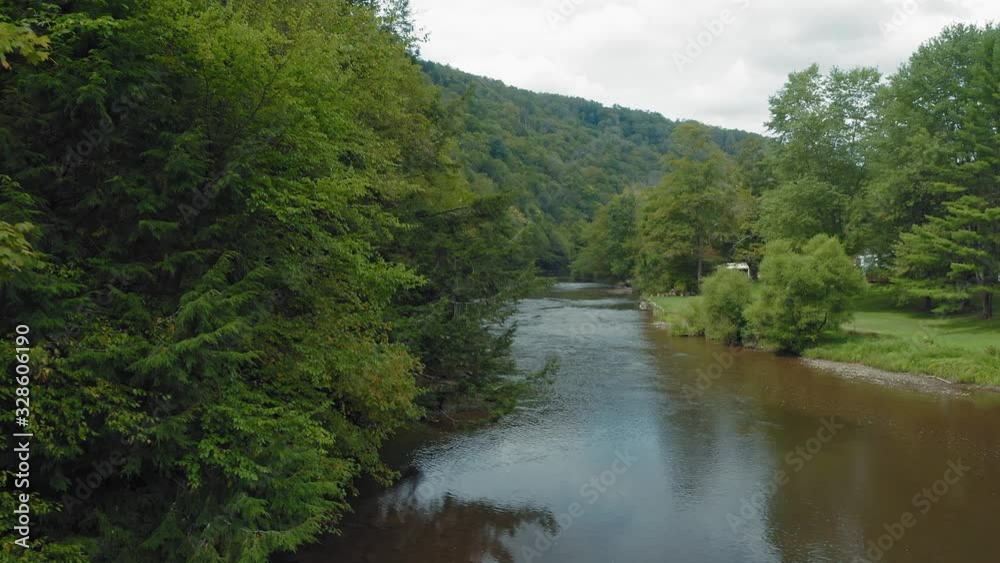 Aerial flying a tranquil river in a forest. Allegheny National Forest, Pennsylvania, USA Aerial flying a tranquil river in a forest. Allegheny National Forest, Pennsylvania, USA