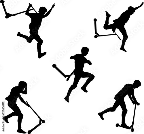 boy silhouette on scooters doing trick