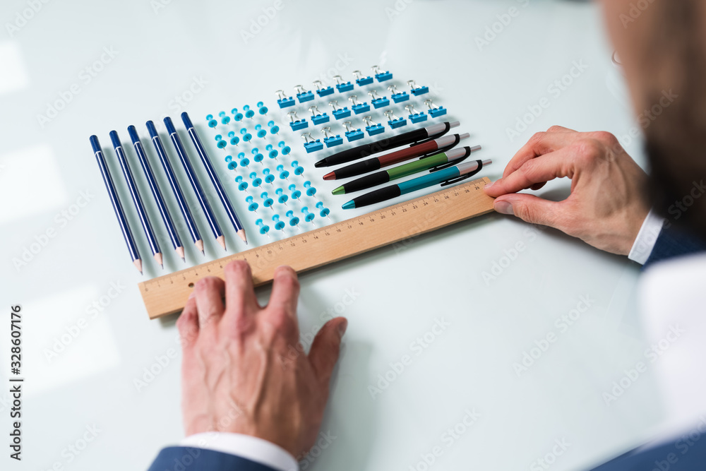 Person Arranging The Clips With Scale Person Arranging The Clips With Scale