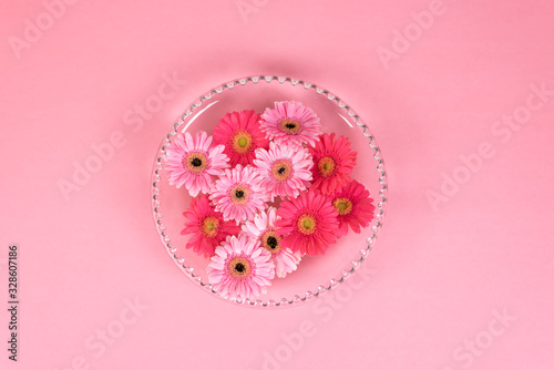 Glass bowl filled with pink flower petals