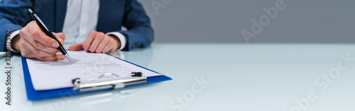 Person Signing Contract photo