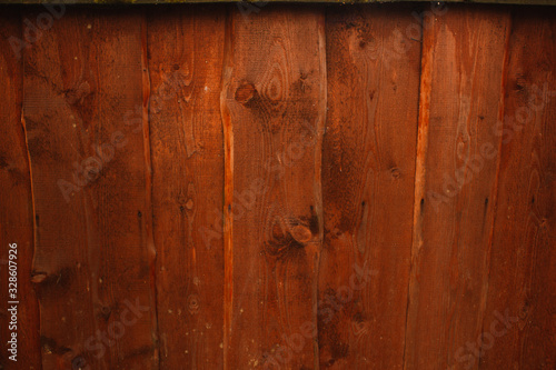 Orange wood fence plank texture background.