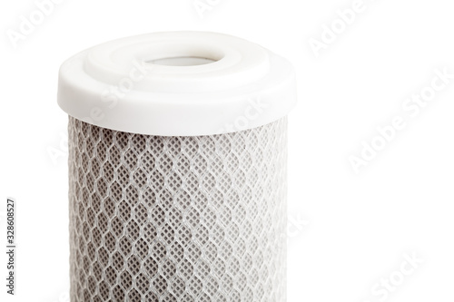 Schilderij op canvas carbon filter for water purification with a mesh structure of fishing line, replaceable cartridge for drinking water purification system close up on white background