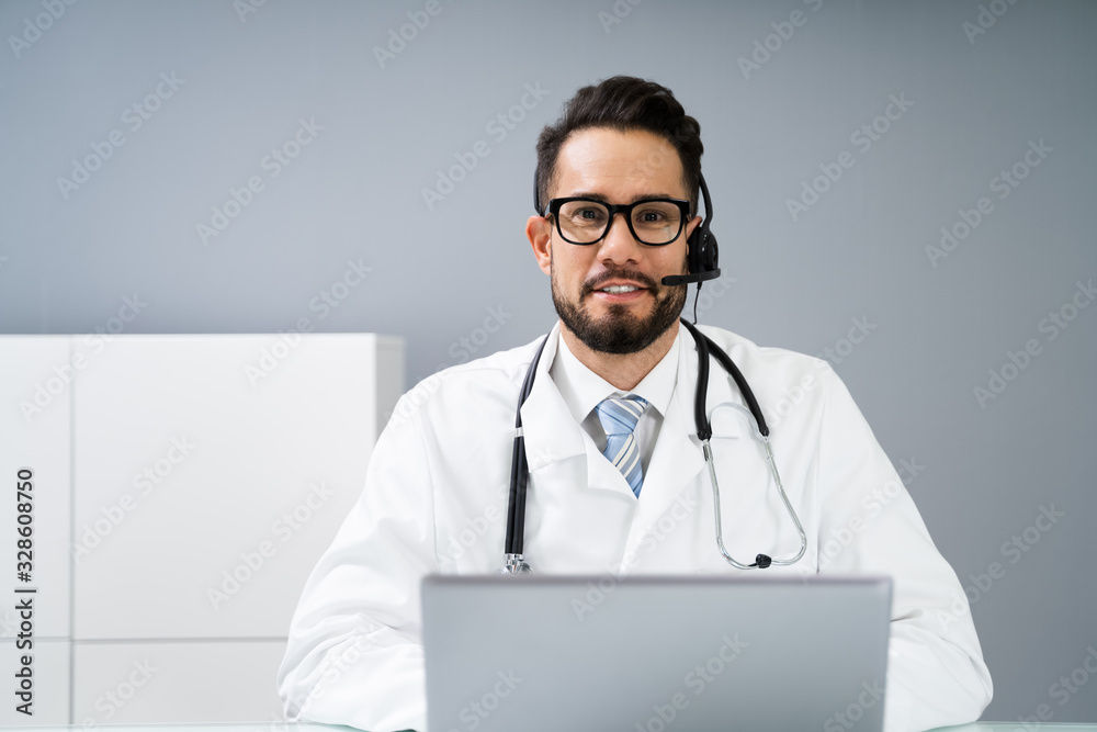 Confident Receptionist Using Headset In Hospital Confident Receptionist Using Headset In Hospital