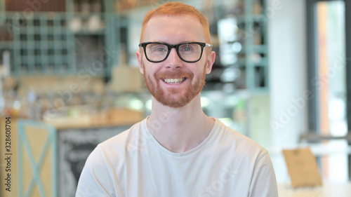 Portrait of Attractive Redhead Man Smiling at Camera