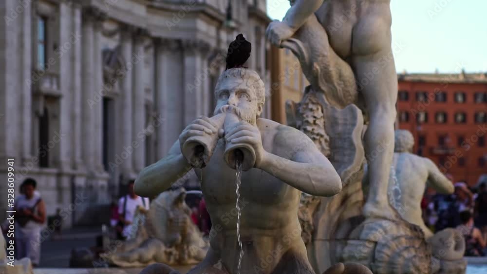 Sculpture on fountain in Piazza Navona in Rome Italy. Steadicam shot. Romantic honeymoon travel destination. Tourism attraction landmark in Europe. Sculpture on fountain in Piazza Navona in Rome Italy. Steadicam shot. Romantic honeymoon travel destination. Tourism attraction landmark in Europe.