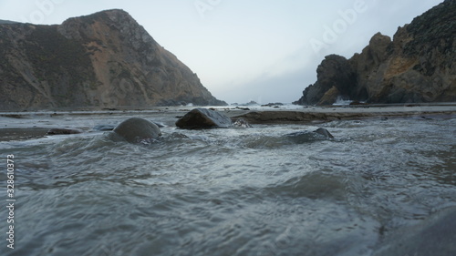moving water on the beach and rocks