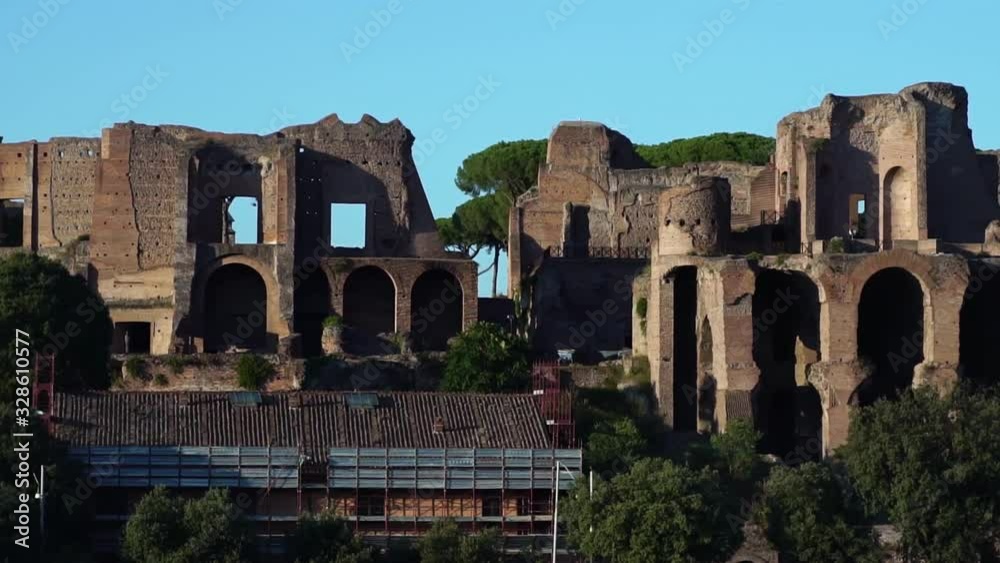 Drone shot low angle. Ruins of colosseum in Rome, Italy. Famous Roman Coliseum. Popular travel destination. Tourism attraction landmark in Europe. 