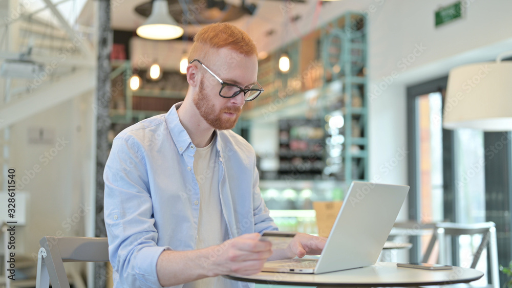 Online Shopping by Redhead Man in Cafe Online Shopping by Redhead Man in Cafe