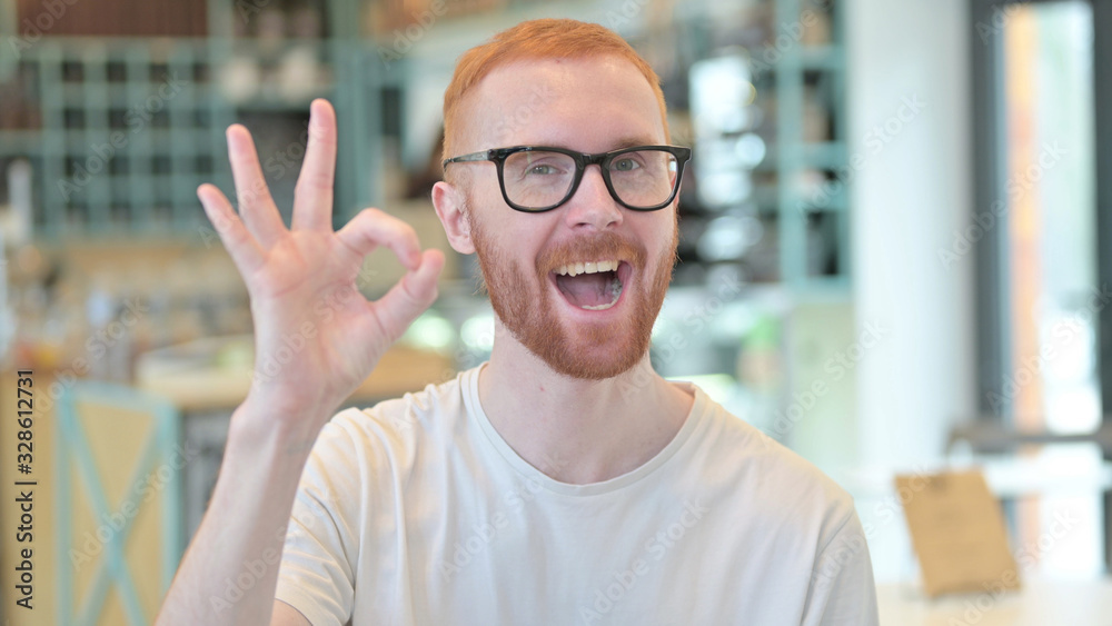 Portrait of Ok Sign by Cheerful Redhead Man Portrait of Ok Sign by Cheerful Redhead Man