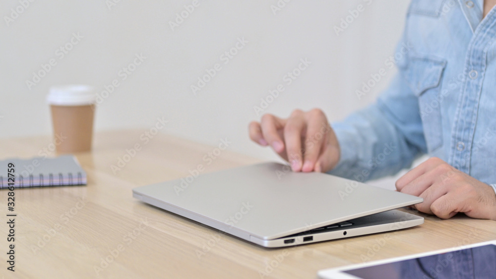 Hands of Male Designer Opening on Laptop Hands of Male Designer Opening on Laptop