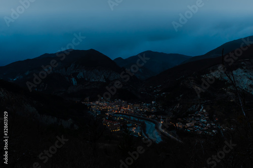 The panoramic view of a medieval French village Puget-Theniers in the dusk © k.dei