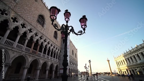 Glide shot. Saint Mark's square, St. Mark’s Basilica. Famous landmark in Venice, Italy. Romantic honeymoon travel & cruise ship destination in Europe.  photo
