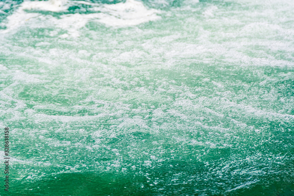 Fototapeta premium water surface of ocean, sea tide. Rapid flow of river