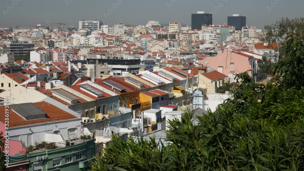 Established shot of Lisbon Portugal overlooking houses and apartments during the day