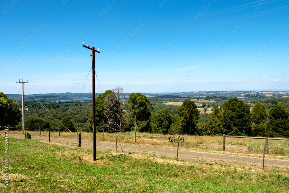 Fototapeta premium A rural road with beautiful grassland and beautiful sky