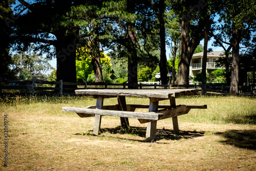 An old wooden bench in front of the house