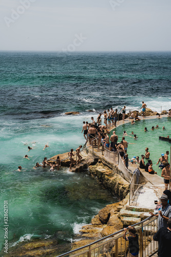 Bronte Beach, New South Wales - JANUARY 20th, 2020: People enjoying the summer weather one weekend at Bronte Baths, Sydney NSW. photo