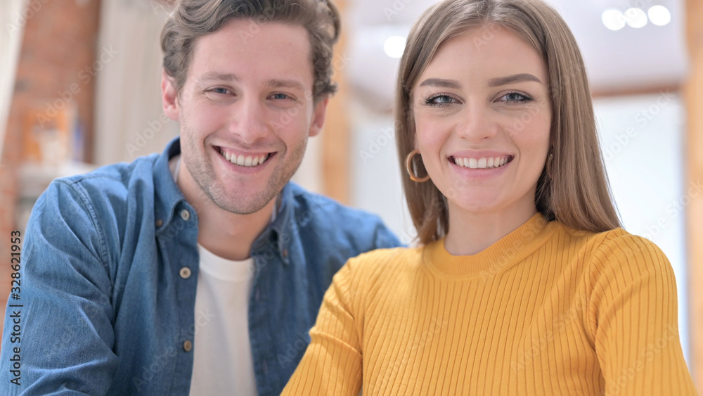 Portrait of Smiling Couple Looking at the Camera Portrait of Smiling Couple Looking at the Camera