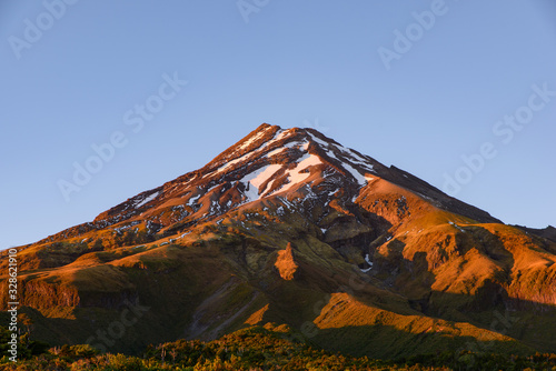 Mount Taranaki with snow on top at sunrise time, New Plymouth, New Zealand