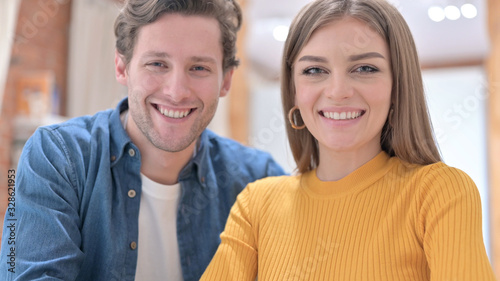 Portrait of Smiling Couple Looking at the Camera