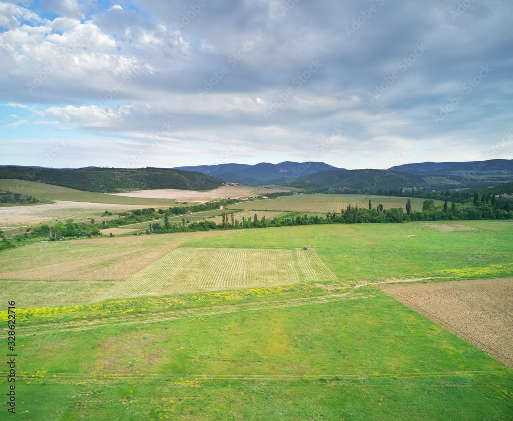 Scenic aerial view of beautiful landscape of the agrecultural valley - obrazy, fototapety, plakaty 