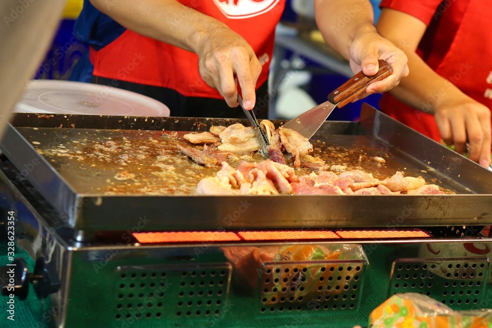 Fototapeta premium chef cutting meat