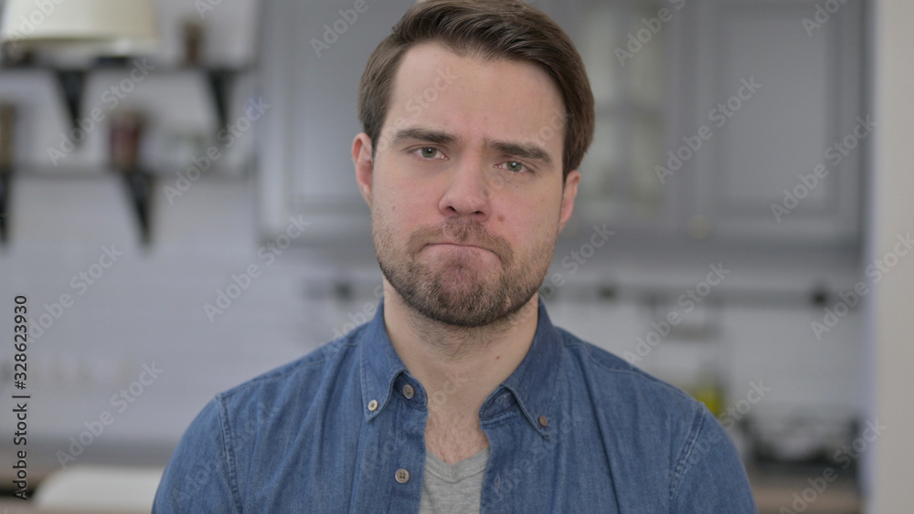 Obraz premium Portrait of Upset Young Man get Disappointed