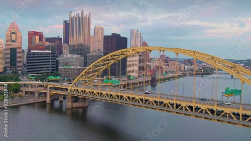 Aerial: Rush hour traffic on the Fort Pitt Bridge crossing the Monongahela River. In the background is downtown Pittsburgh skyline. Pennsylvania, USA.  photo