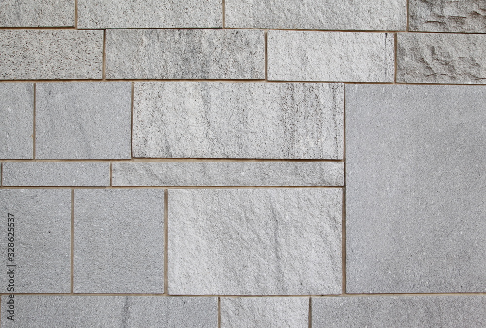 Fototapeta premium Gray stone wall closeup background photo texture