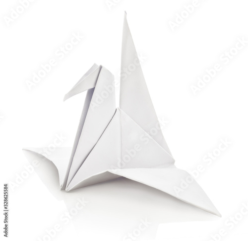 White paper bird folder. Isolated on white background with shadow reflection. With clipping path. With vector path. Single paper pigeon on white bg. White japanese origami crane on reflective underlay