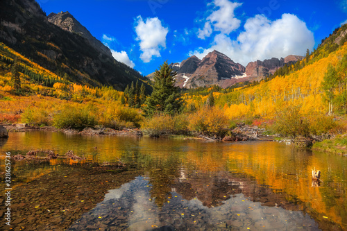 Perfect reflections of maroon bells in the lake