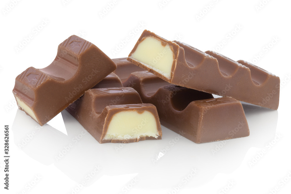 Chocolate bars with milk filling. Isolated on white background with shadow reflection. With clipping path. With vector path. Milk dessert on white bg. Chocolates on white reflective underlay. Chocolate bars with milk filling. Isolated on white background with shadow reflection. With clipping path. With vector path. Milk dessert on white bg. Chocolates on white reflective underlay.