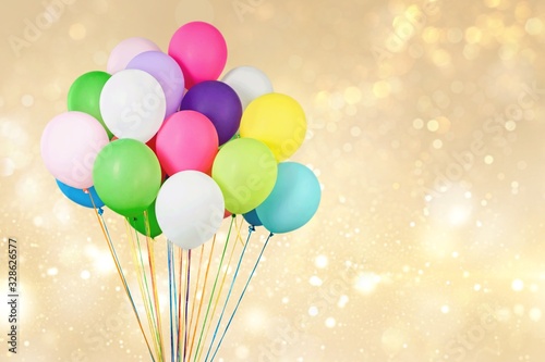 Bunch of colorful balloons on abstract background