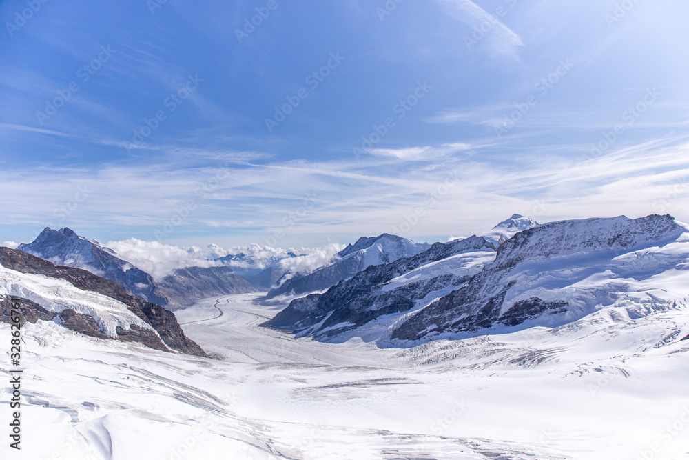 Great Aletsch glacier and Bernese Alps and jungfrau snow mountain peak  with blue sky background view from Jungfraujoch top of Europe, Switzerland