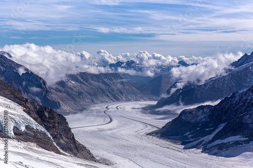 Great Aletsch glacier and Bernese Alps and jungfrau snow mountain peak with blue sky background view from Jungfraujoch top of Europe, Switzerland