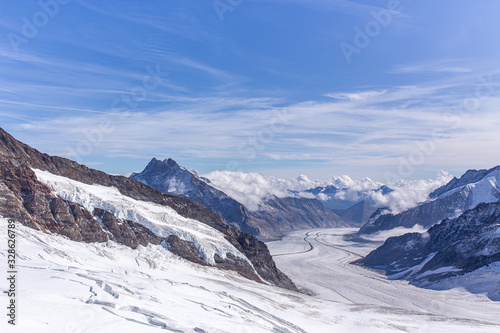 Great Aletsch glacier and Bernese Alps and jungfrau snow mountain peak with blue sky background view from Jungfraujoch top of Europe, Switzerland