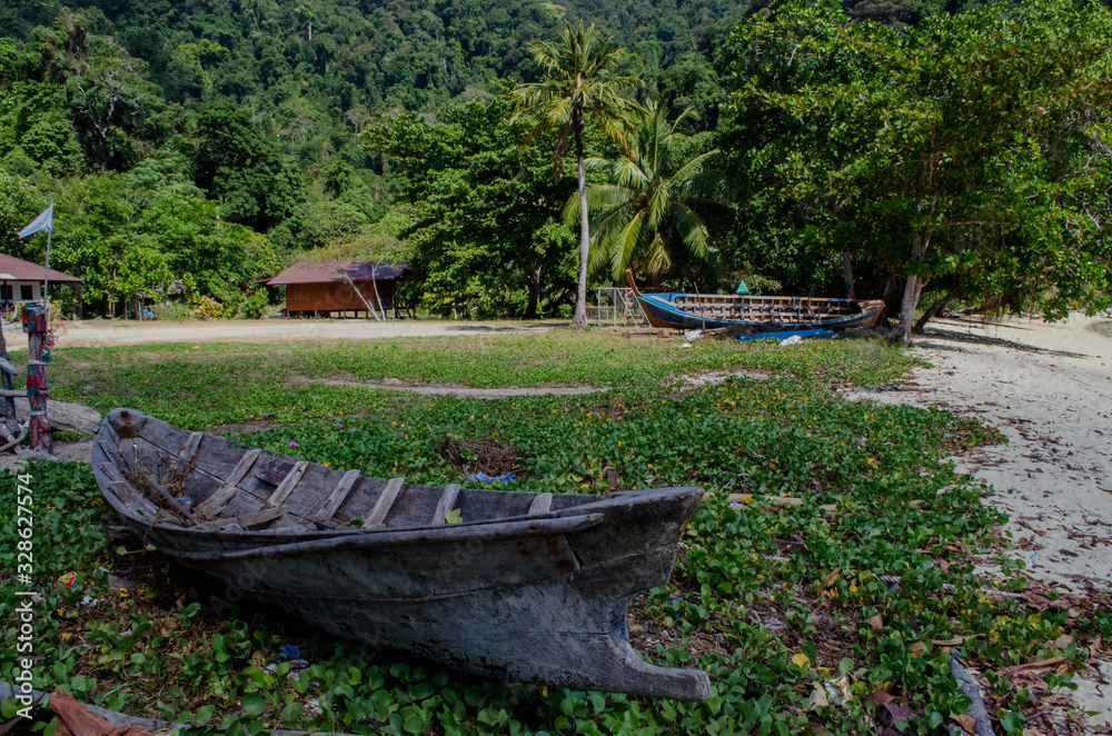 rowboat used by the moken, Old boat in moken village, Surin Island, Thailand rowboat used by the moken, Old boat in moken village, Surin Island, Thailand