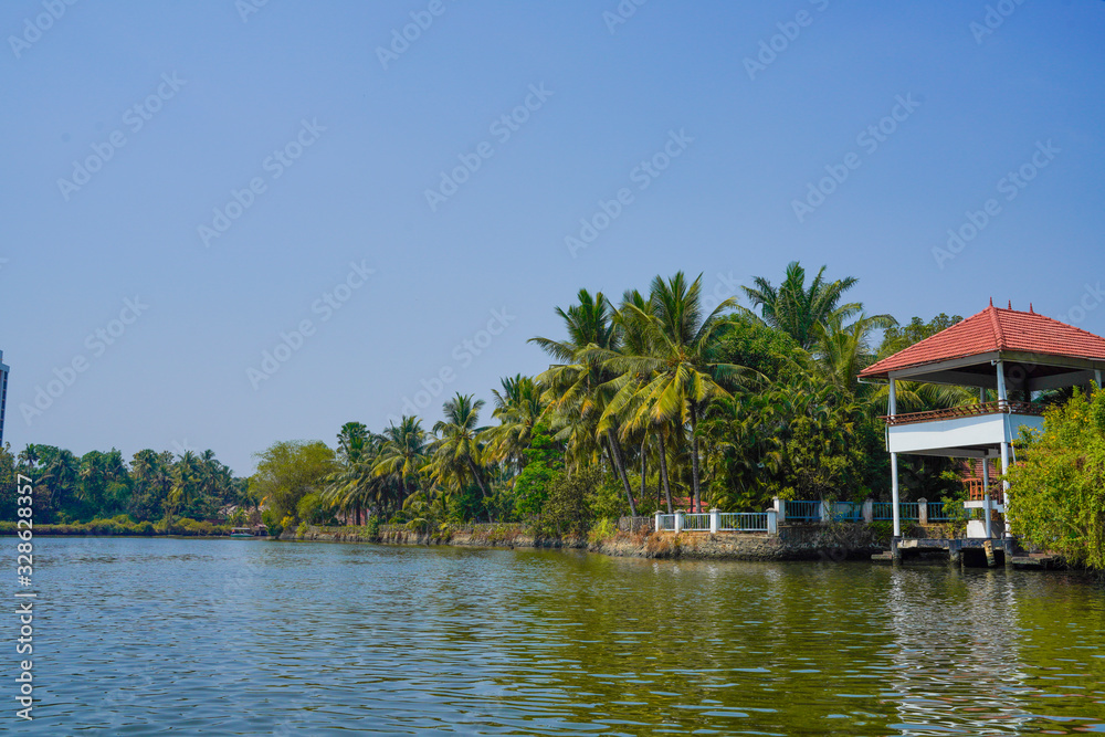 Beautiful river side tree and house view in kochi Kerala India.