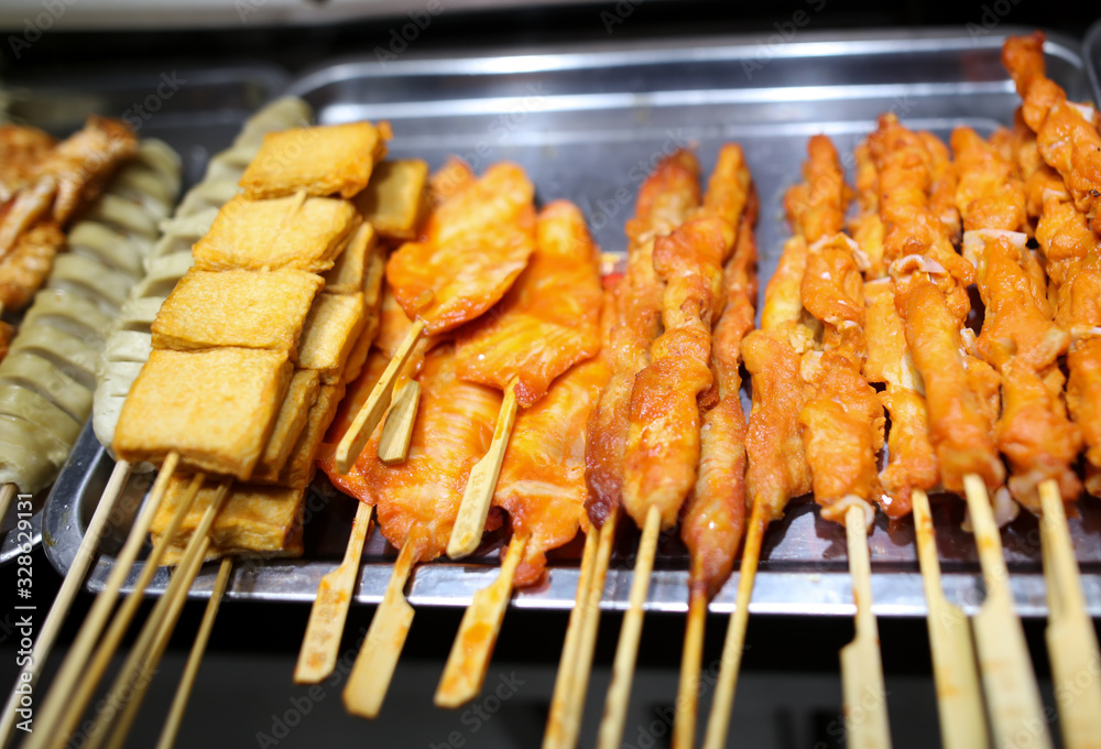 Animal meat on wooden sticks for grilling