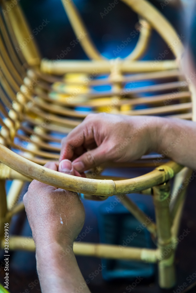 Restoration of rattan chair with white thread. Recycling, upcycling and ...