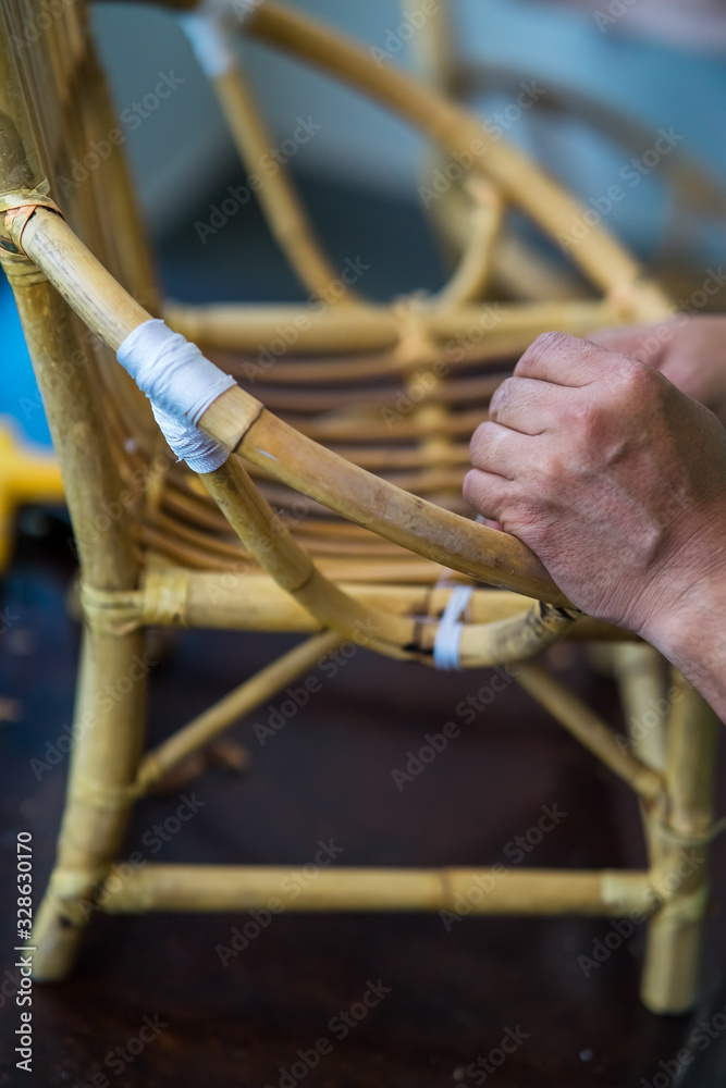 Restoration of rattan chair with white thread. Recycling, upcycling and ...