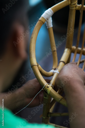 Restoration of rattan chair with white thread. Recycling, upcycling and from trash to reasure concept. Reuse for the environment. photo