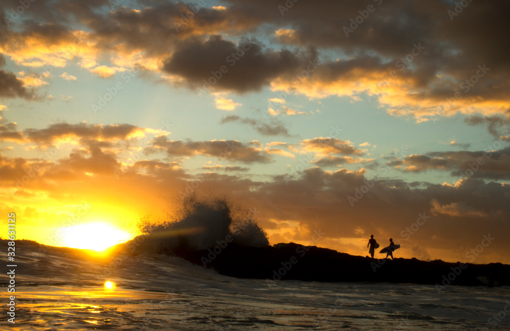Surfers enter surf