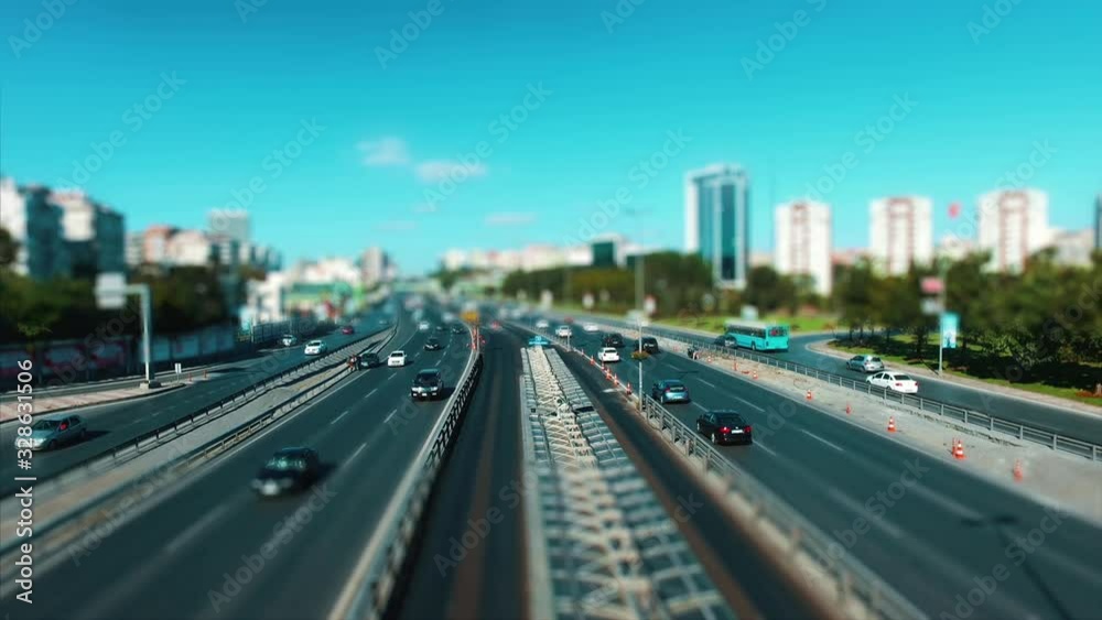 Time lapse Car traffic on a wide road, transportation and infrastructure development in urban city with tilt and shift effect Time lapse Car traffic on a wide road, transportation and infrastructure development in urban city with tilt and shift effect