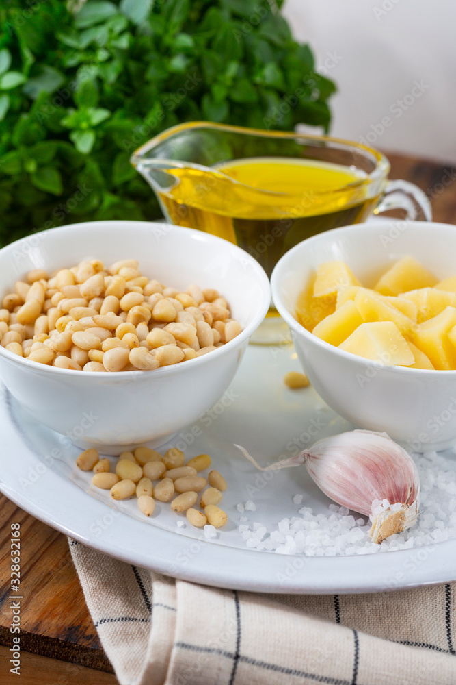 Pesto sauce ingredients on wooden table. Pesto sauce ingredients on wooden table.