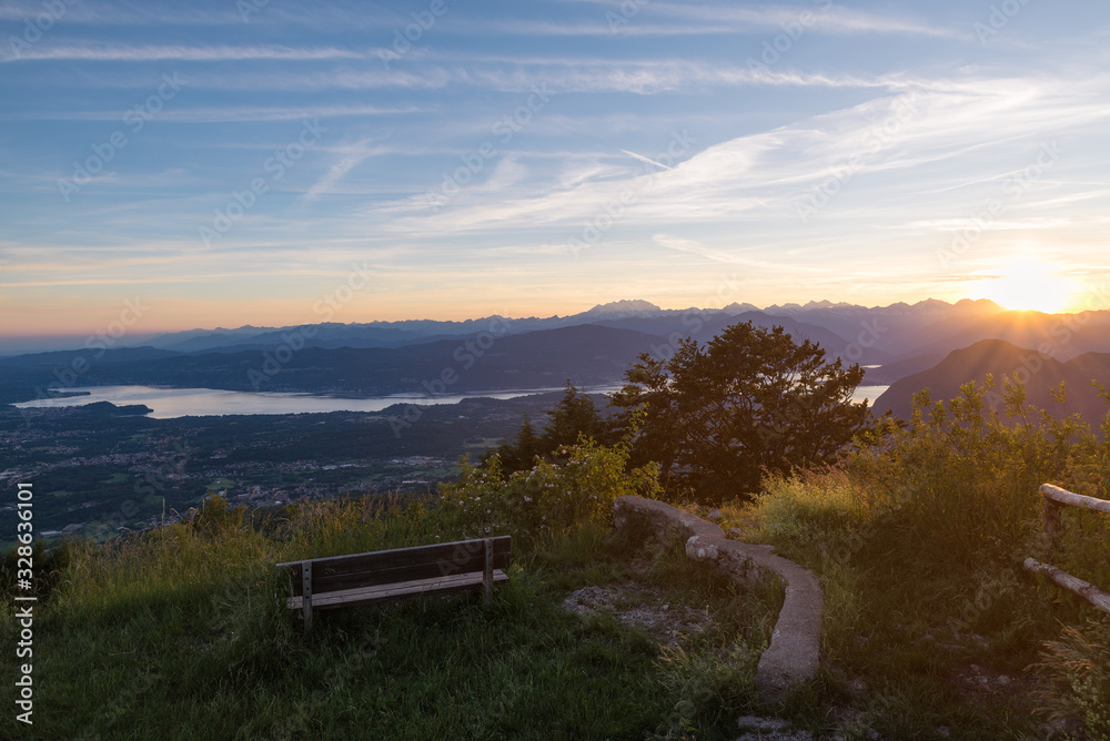 Big european lake and the Alpine chain at sunset. Lake Maggiore with the Alps and the Monte Rosa in the background. Scenic aerial view from the Campo dei Fiori regional park of Varese
