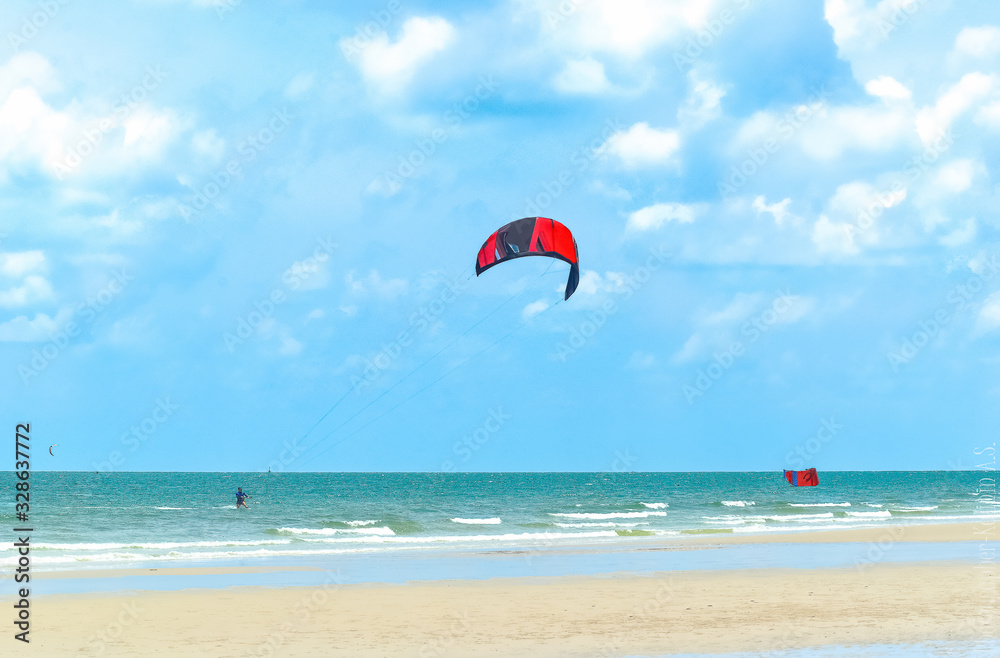kitesurfing on the blue sea on a bright Sunny day kitesurfing on the blue sea on a bright Sunny day