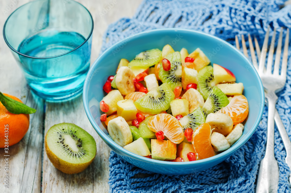 Healthy fruit salad on wood background Healthy fruit salad on wood background